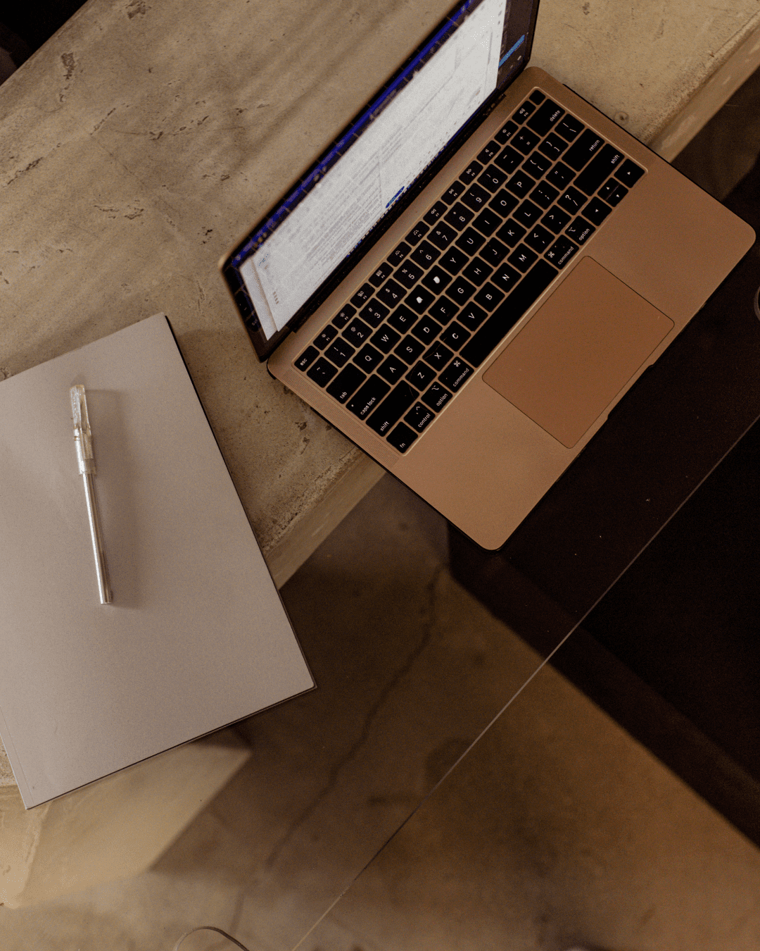 laptop and notebook. How to start an email newsletter.